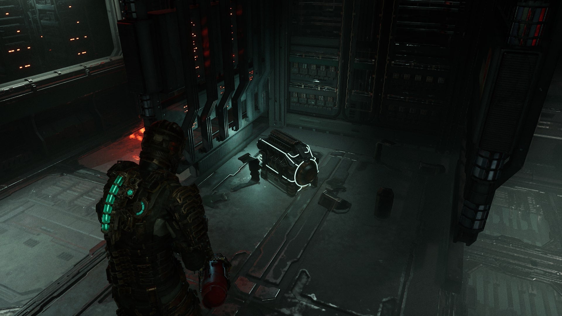 Isaac picks up a power cell in Dead Space