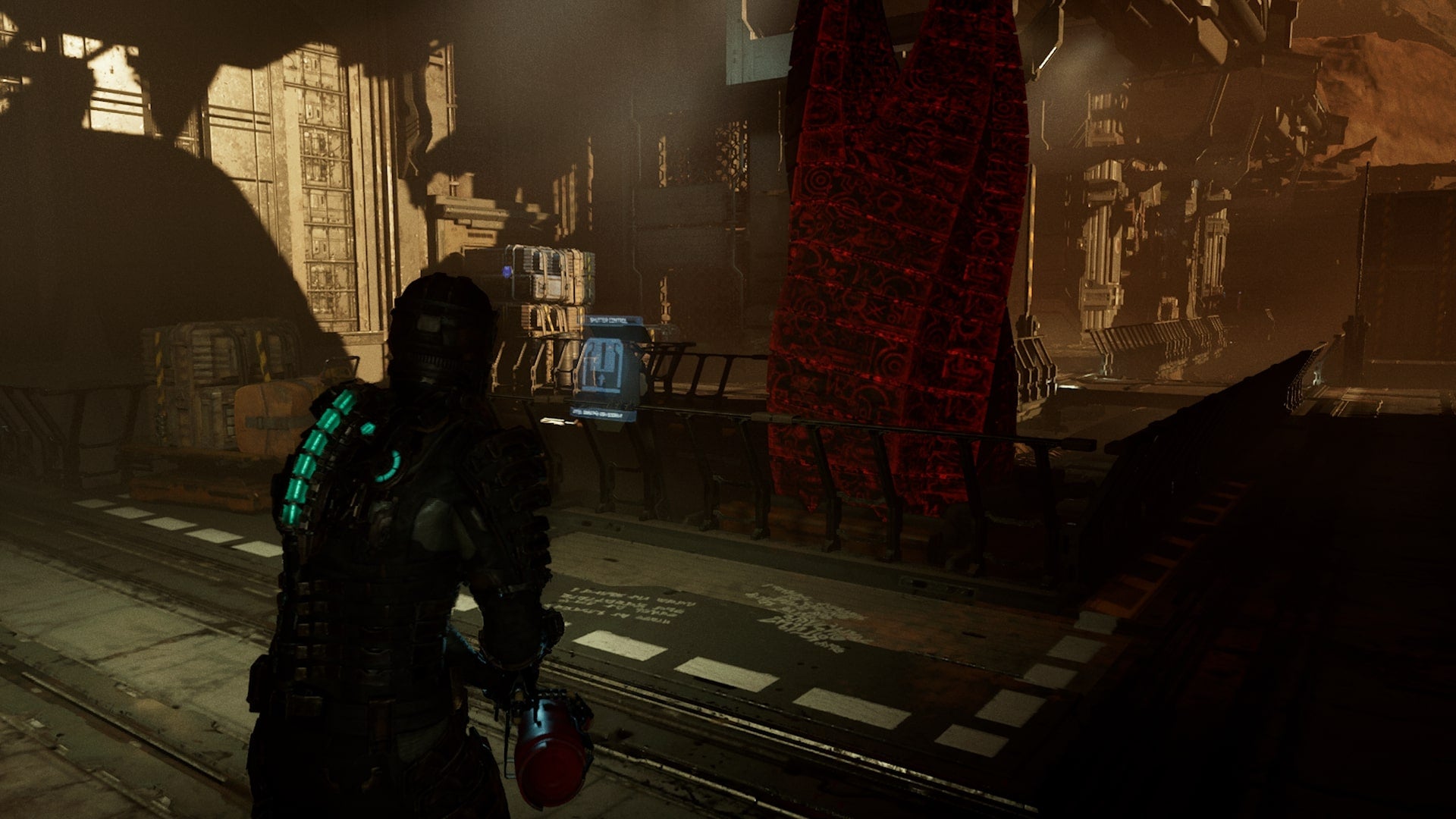 Isaac looks at a control panel in front of The Marker in Dead Space