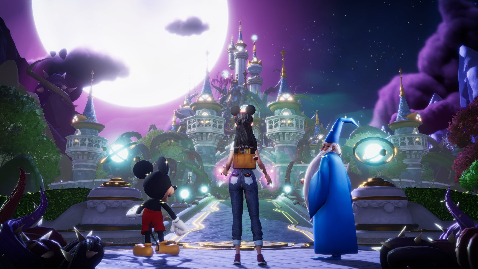 Mickey, Merlin, and the player character overlook a castle at night in Disney Dreamlight Valley