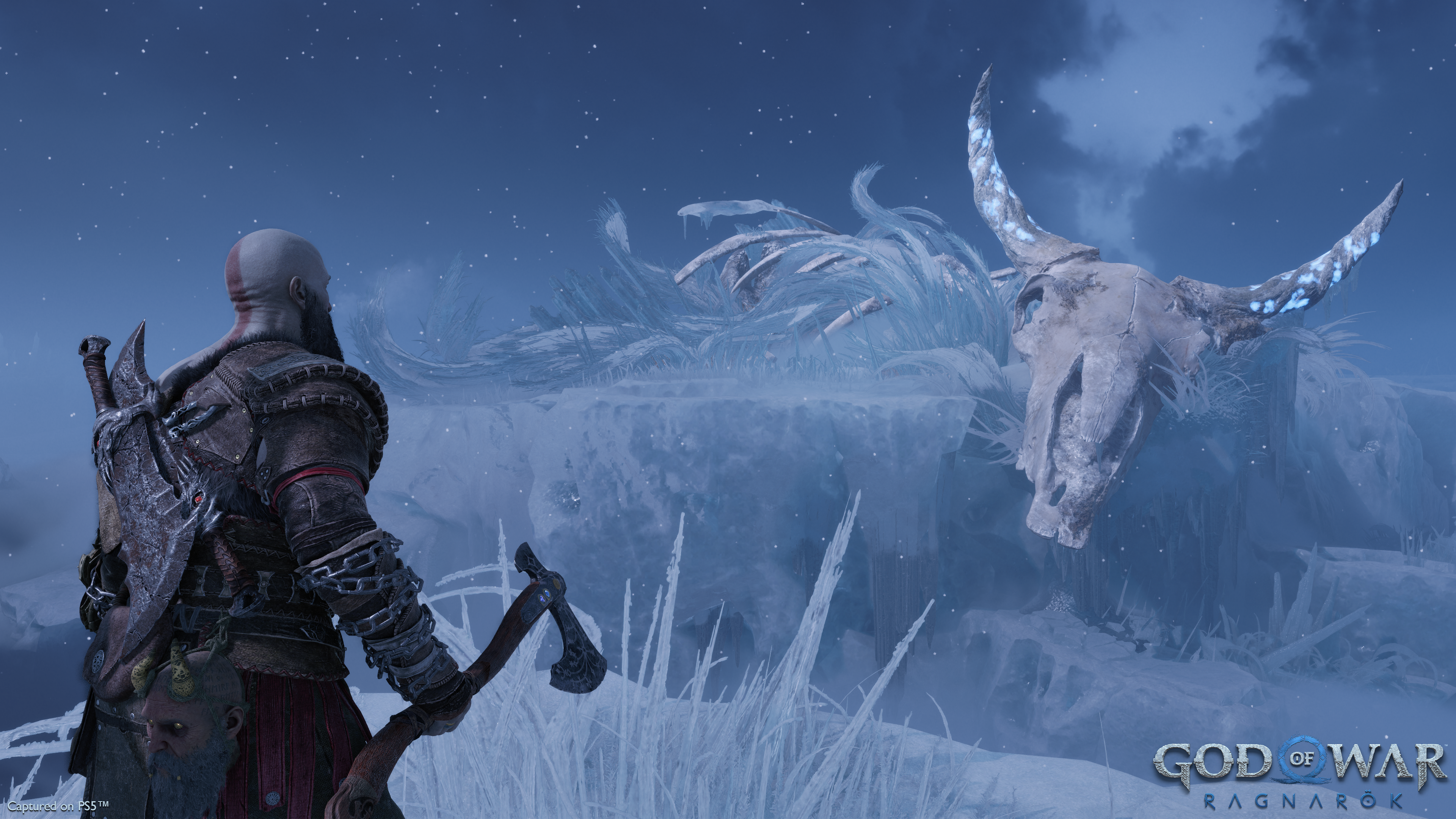 Kratos surveys a giant skeleton in God of War Ragnarok