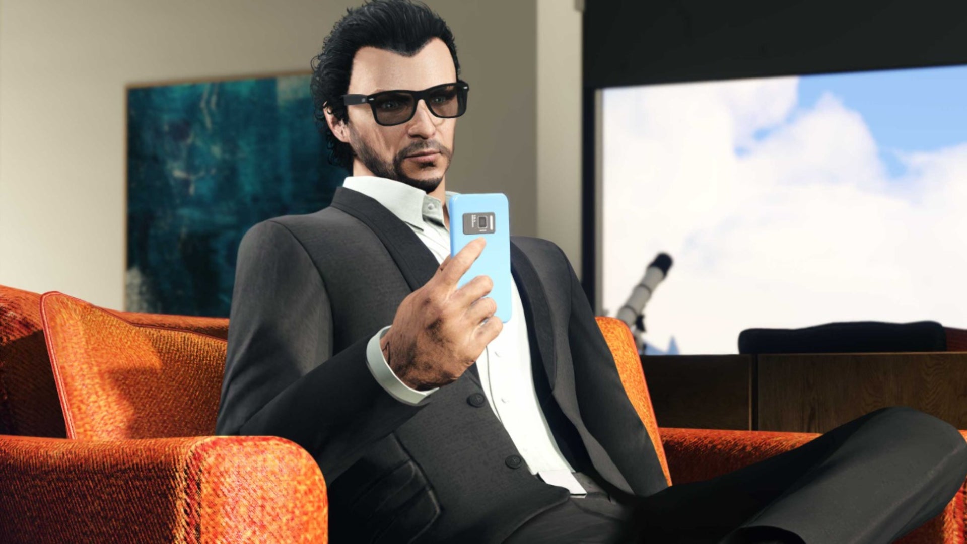 GTA Online Rockstar Newswire image of a character sat on a sofa wearing sunglasses and holding a phone.
