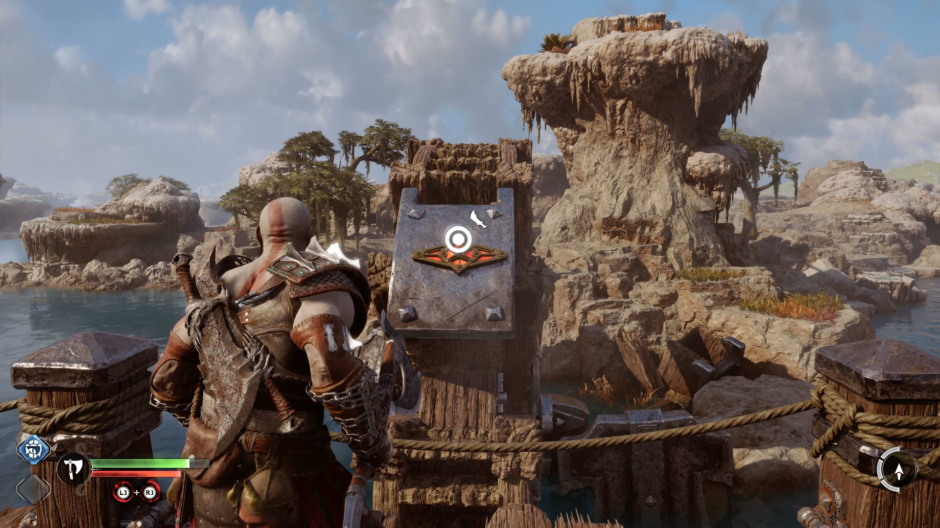 Kratos spinning a water wheel in the Aurvangar Wetlands in God of War Ragnarok