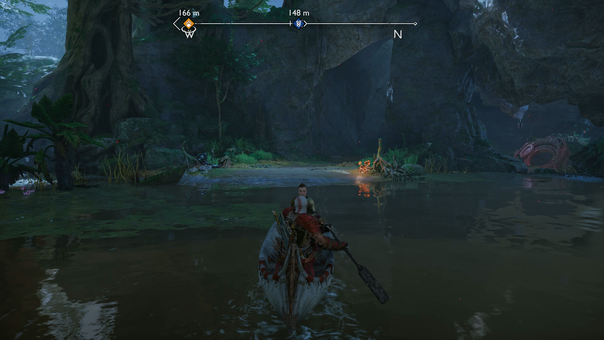 Kratos and Atreus rowing a boat in Vanaheim in God of War Ragnarok