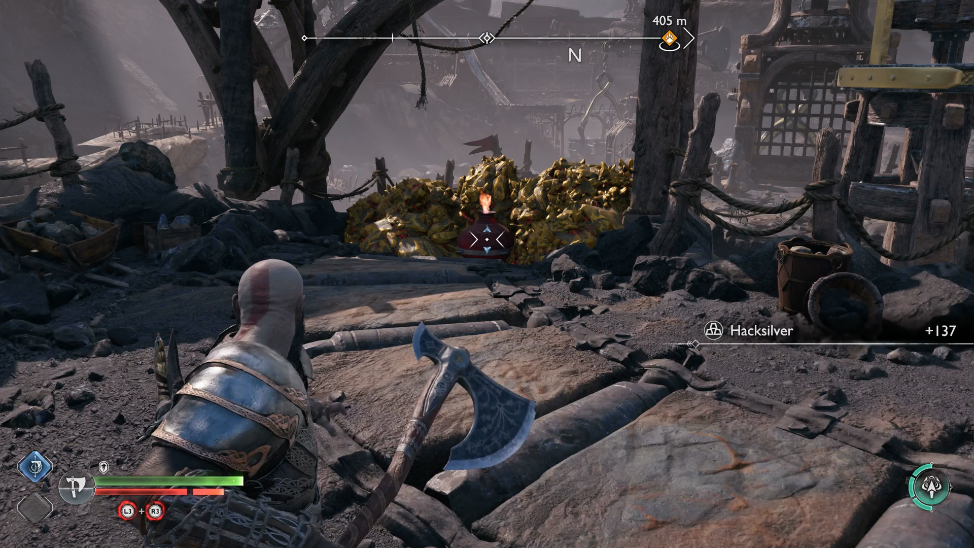 Kratos destroying some rocks with a flaming pot in God of War Ragnarok