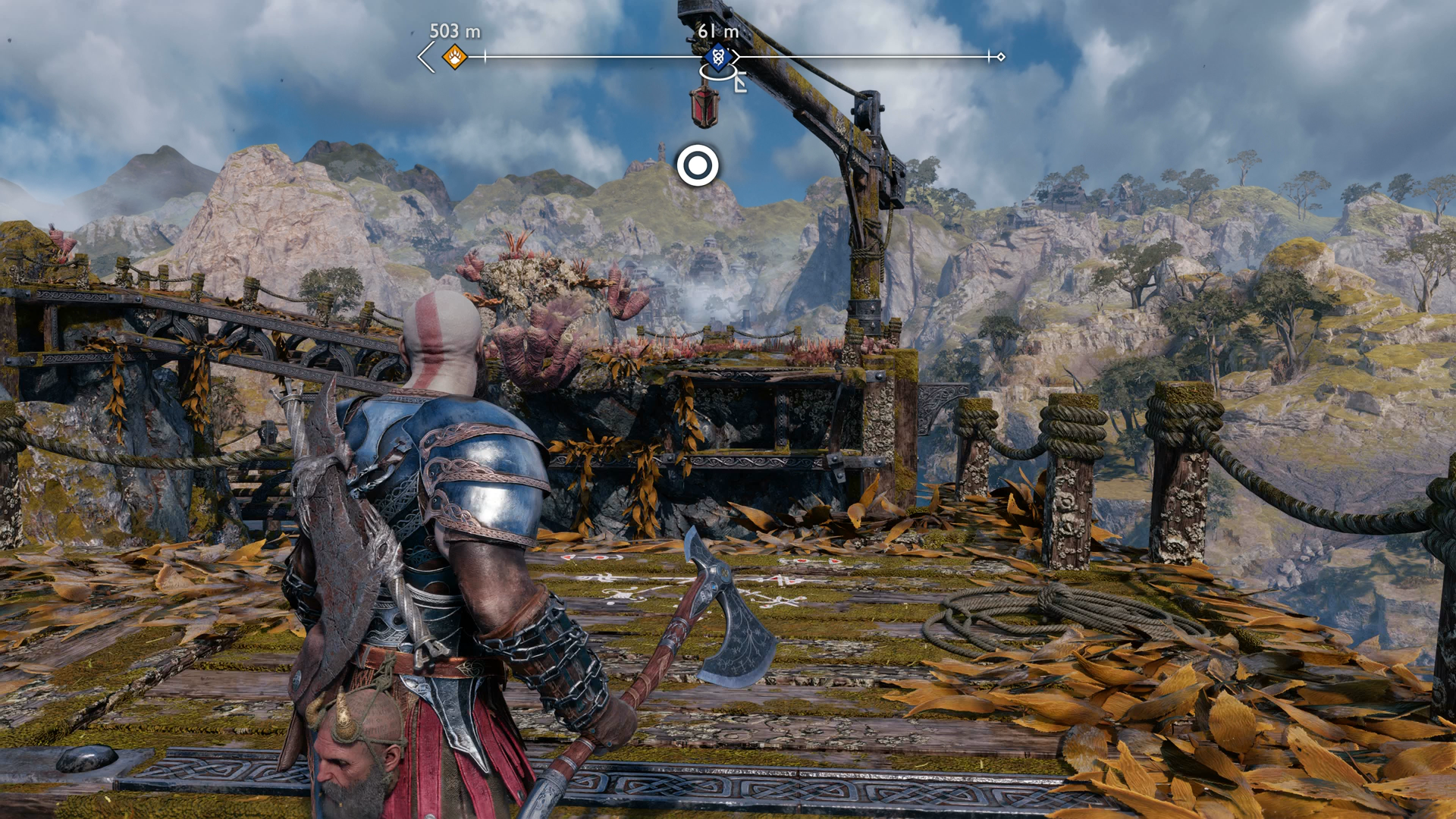 Kratos using his Blades of Chaos to swing across a gap in the Weight of Chains quest