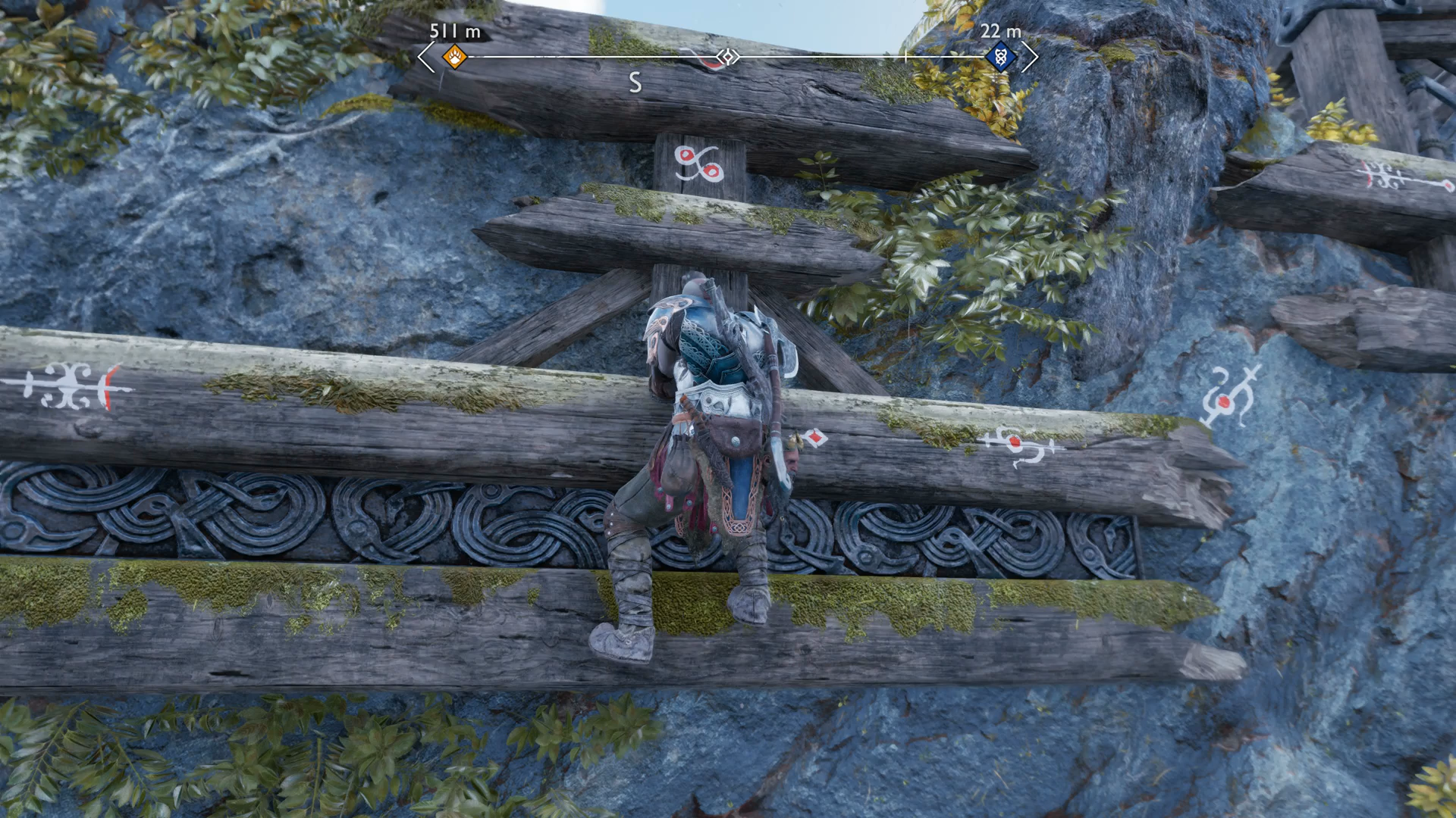 Kratos shimmying across a ledge during the Weight of Chains quest in God of War Ragnarok