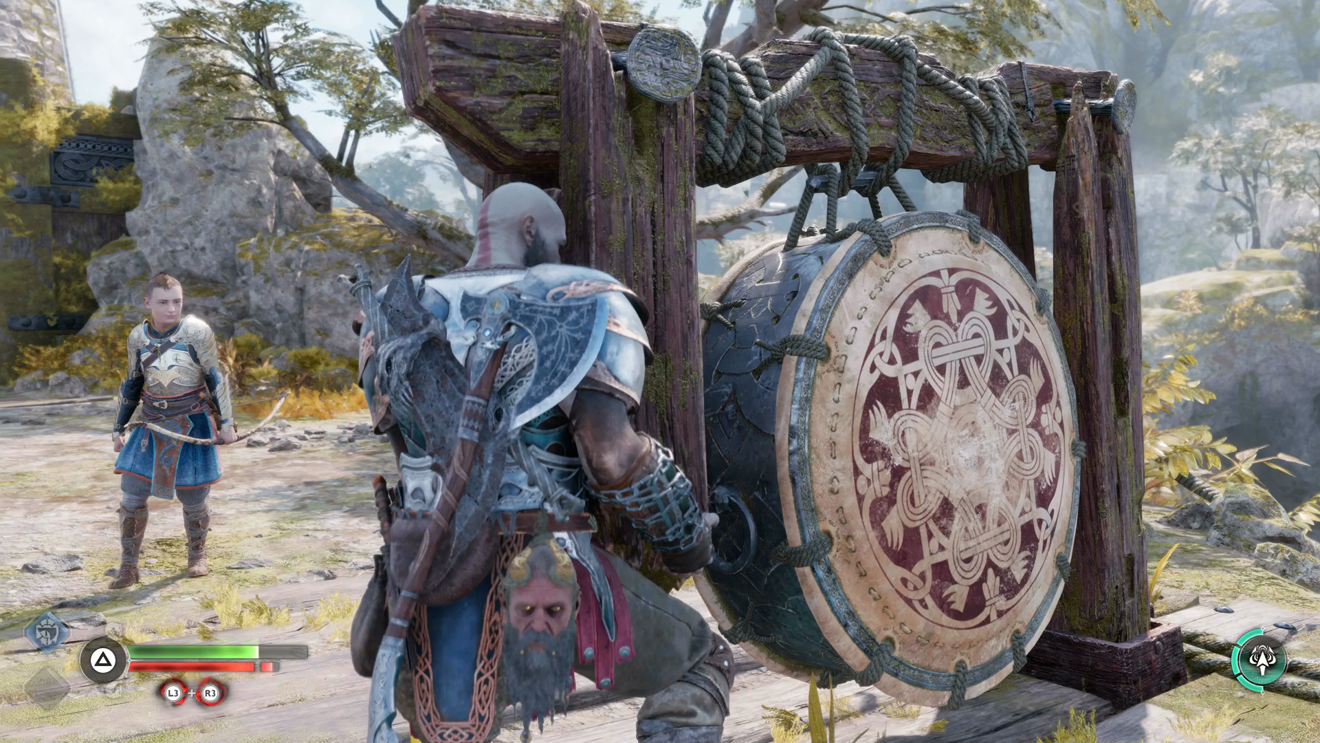 Kratos and Atreus sound a giant drum during the Weight of Chains quest in God of War Ragnarok