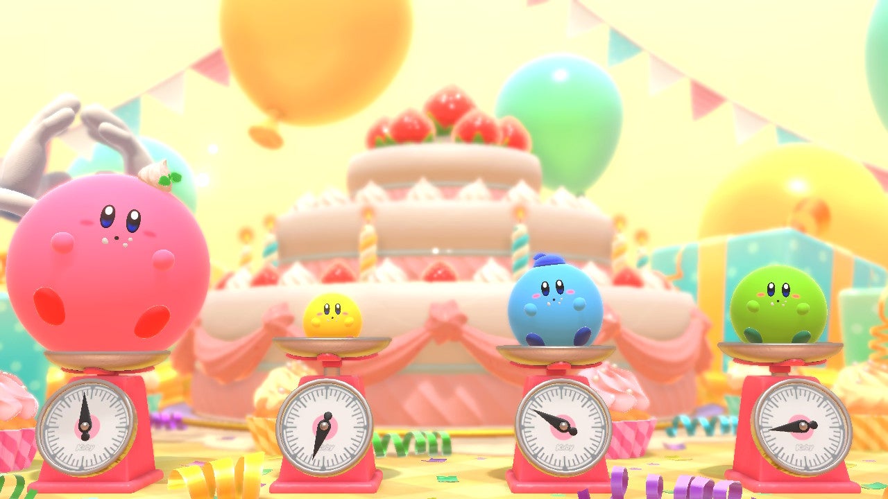 Quatre Kirby de couleurs différentes pèsent après un grand prix au Kirby's Dream Buffet