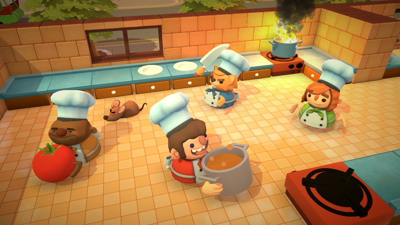 Four players are fulfilling kitchen duties in Overcooked!