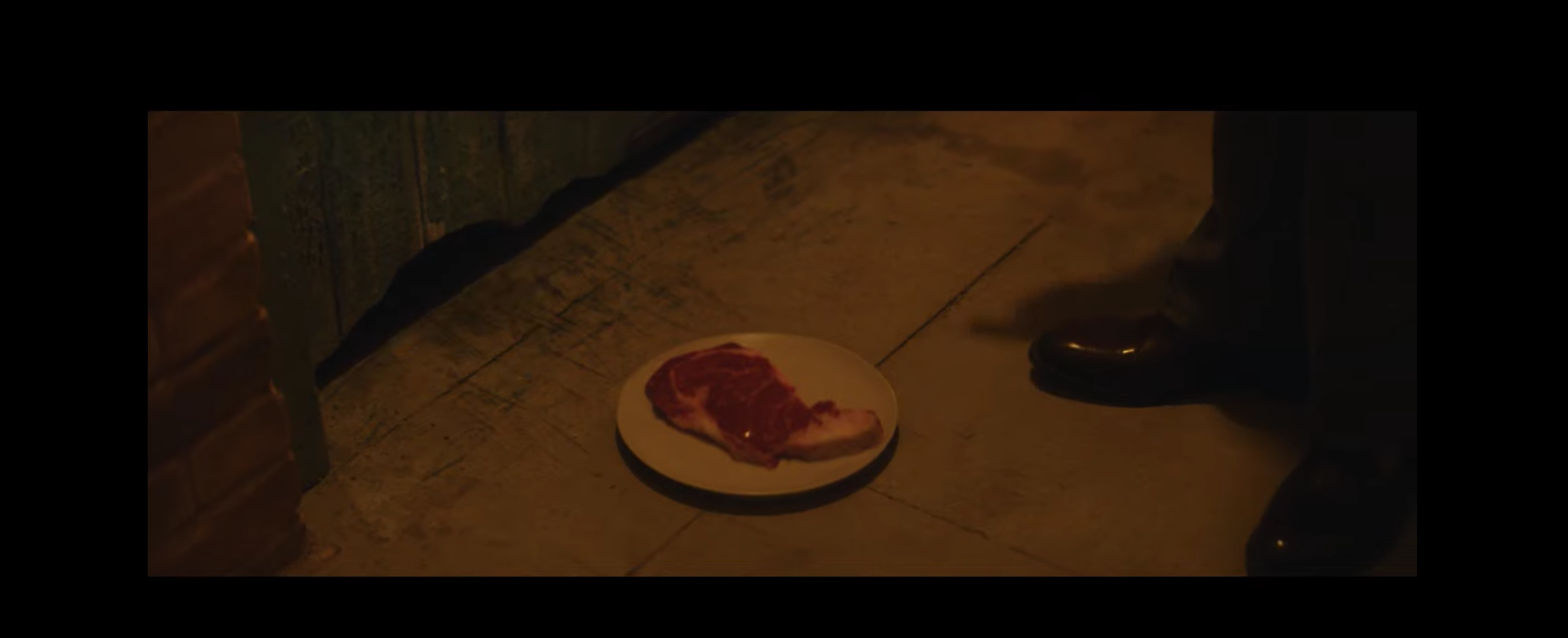 PS Plus commercial, Mr. Malcoim feeding a hostage steak