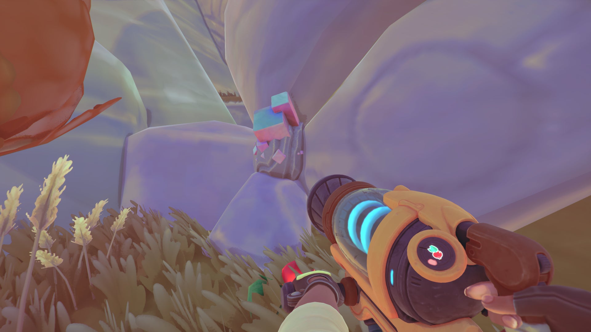 A player points their vacpac at some Radiant Ore in Slime Rancher 2