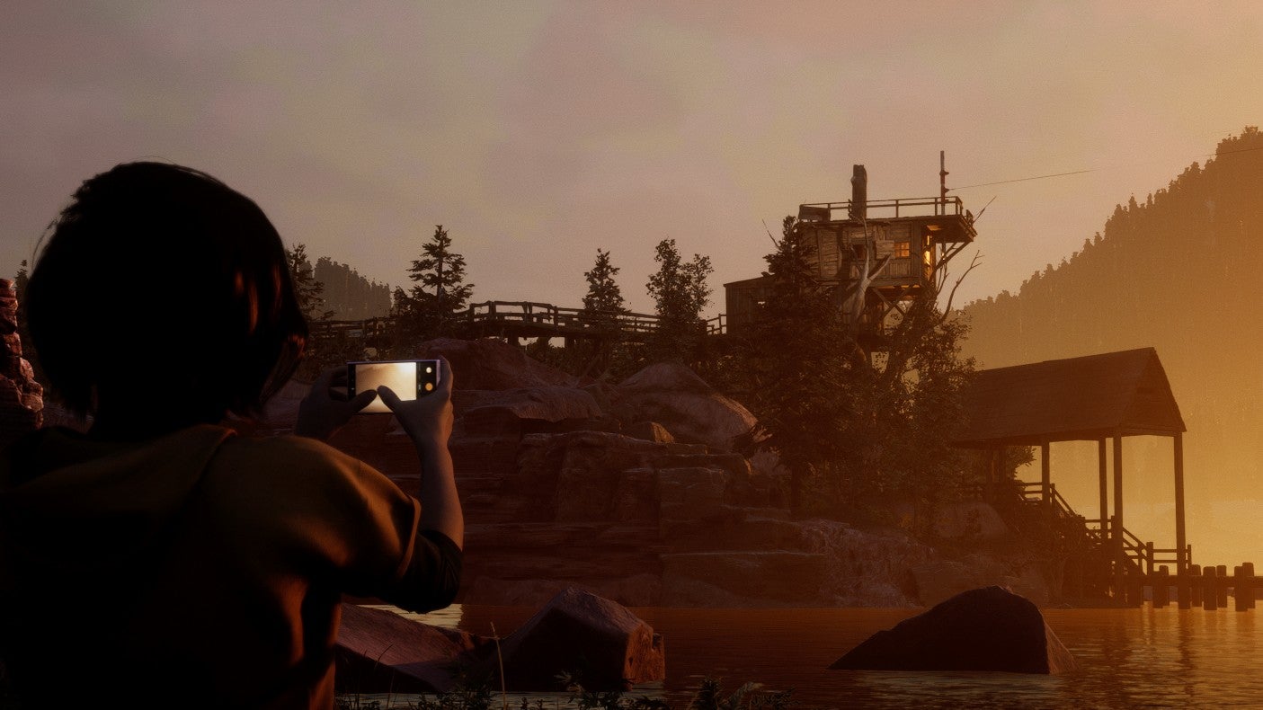 Kaitlyn takes a photo overlooking Hackett's Quarry in slasher-narrative game, The Quarry.