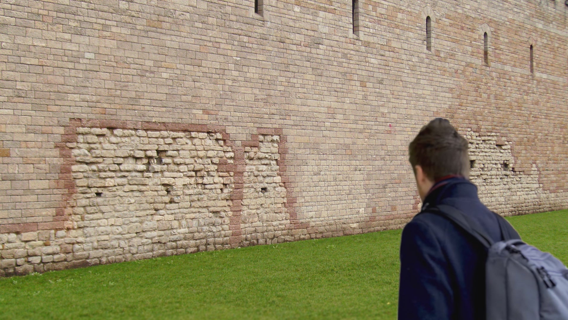 Chris Bratt in Cardiff looking at a wall