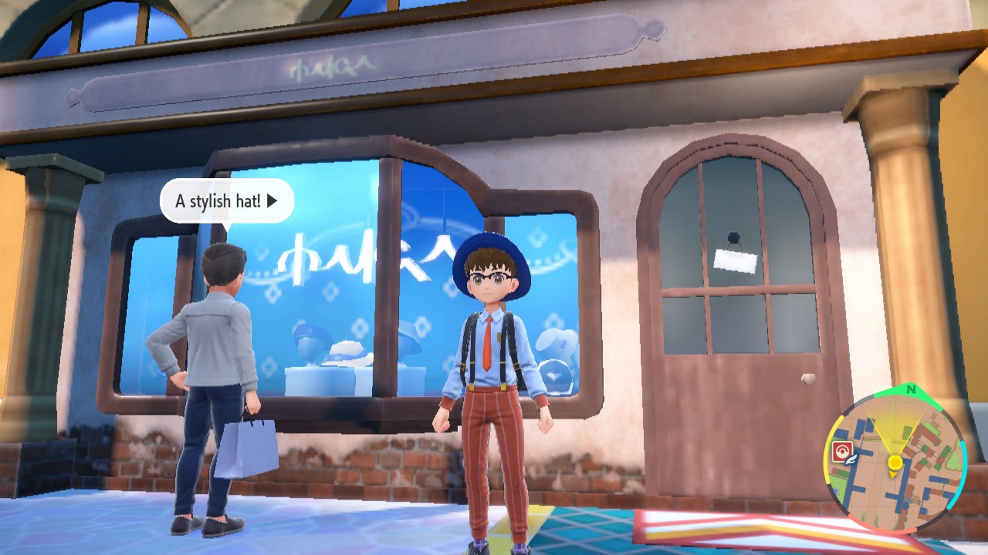 Change clothes in Scarlet and Violet: An anime child in a white shirt, blue hat, and orange pants stands in front of a white stone building with hats in a window display case