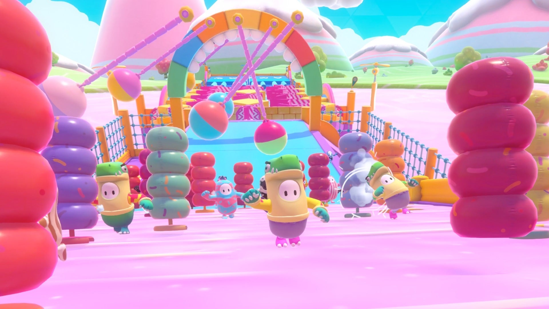 Fall Guys players running up a slippery slide!