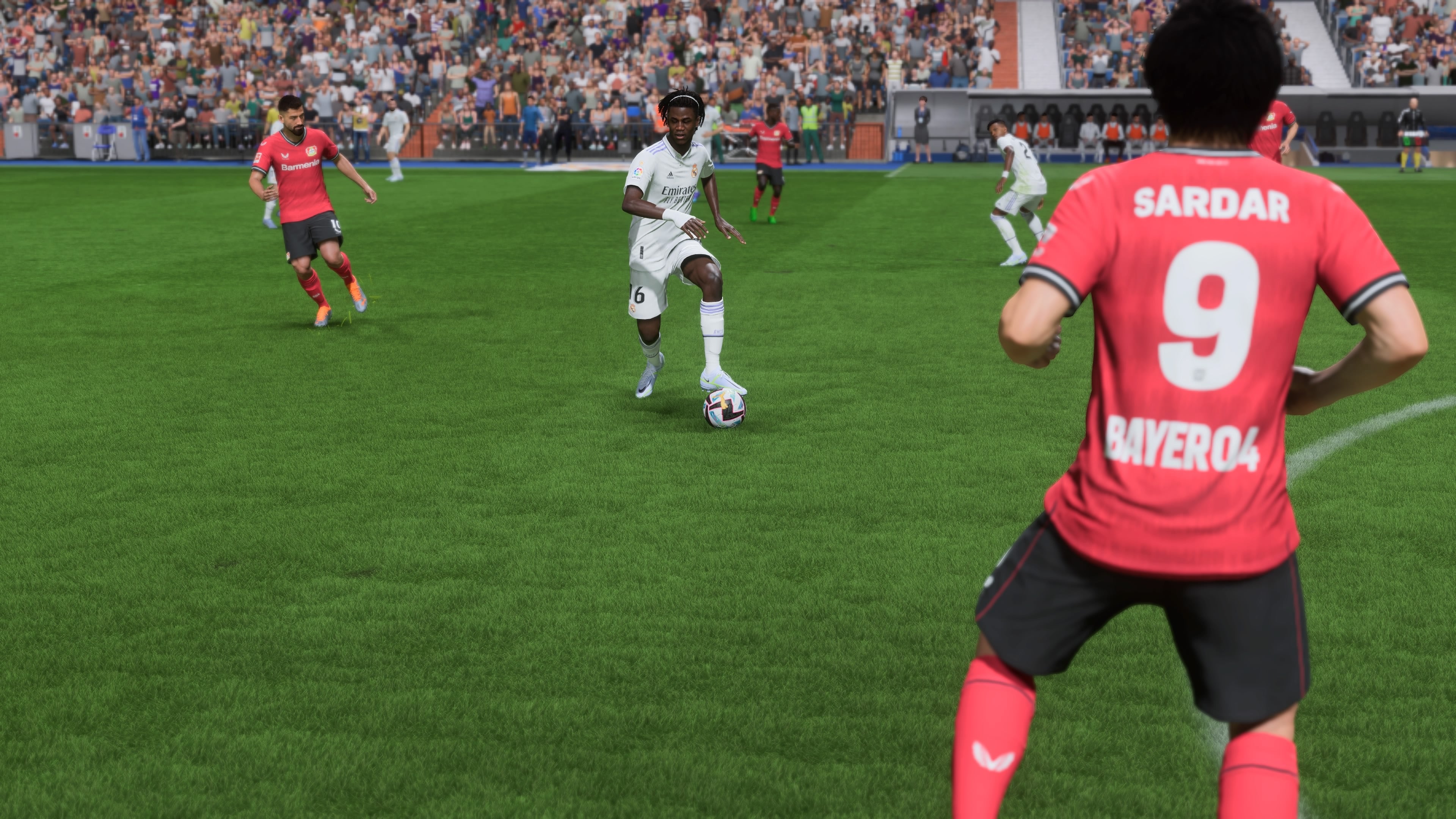 Eduardo Camavinga looks for a forward pass in a FIFA 23 match against Bayer Leverkusen