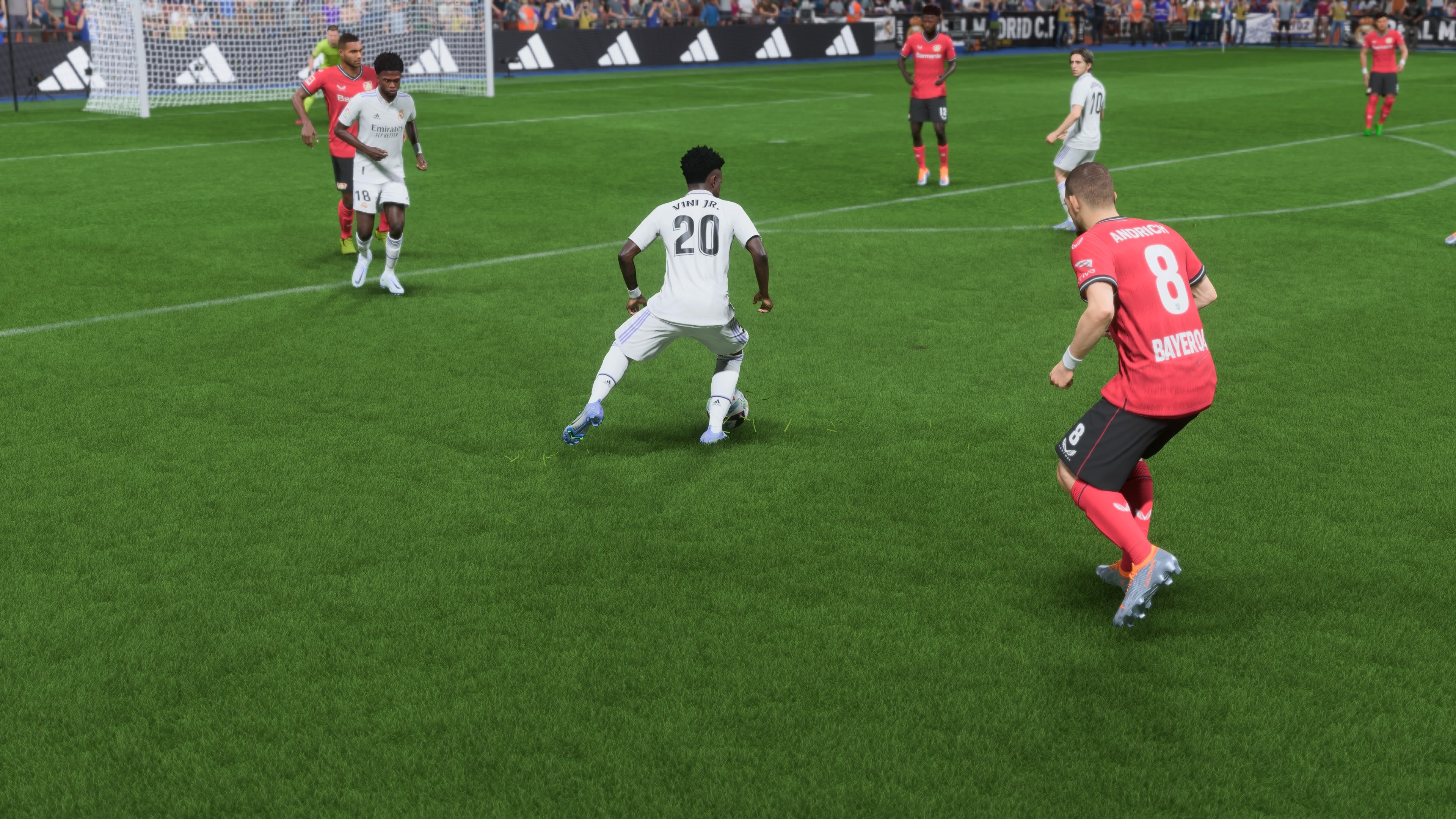 Real Madrid Wonderkid Vinicius Jr dribbles past defenders towards the goal in FIFA 23