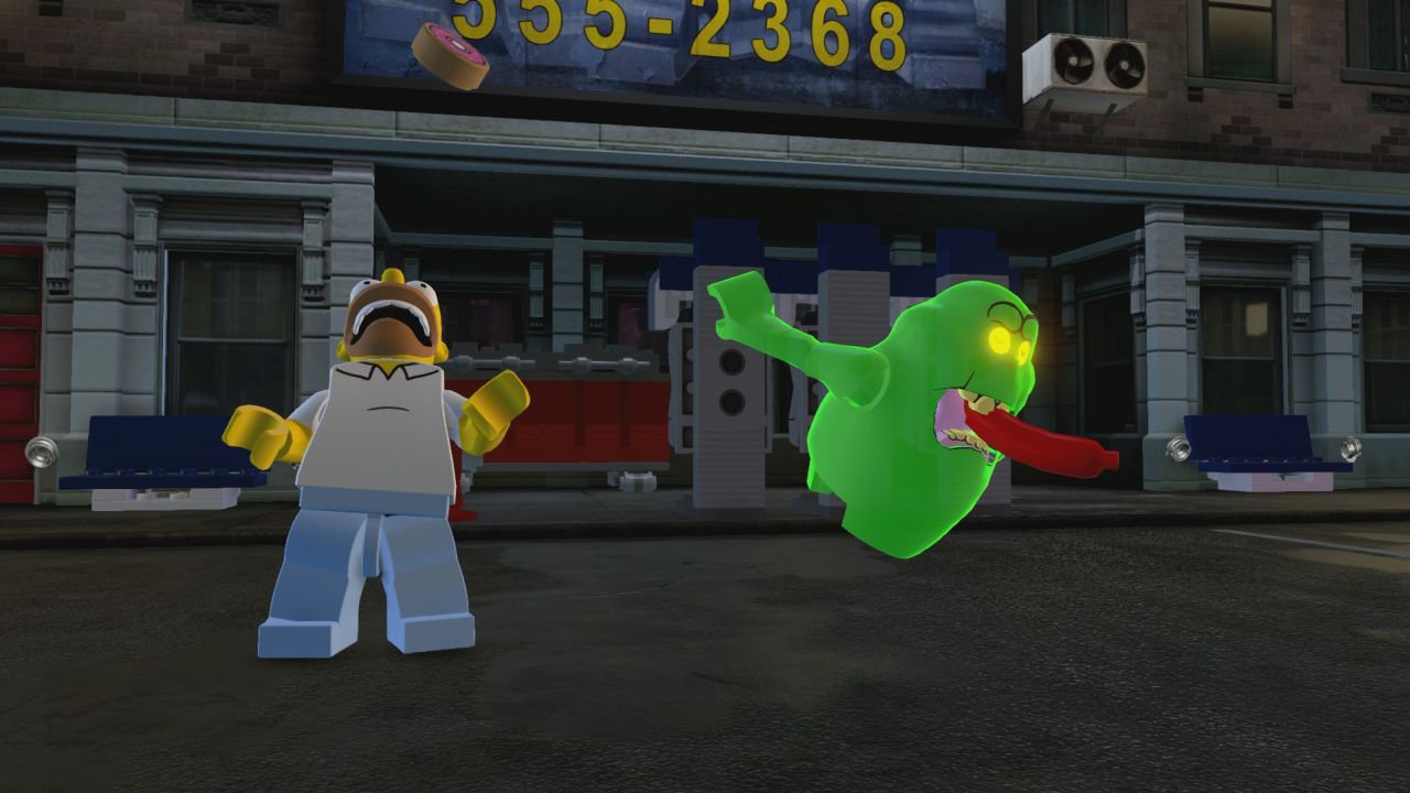 The in-game screenshots for LEGO Dimensions show Homer hanging Slimer | VG247