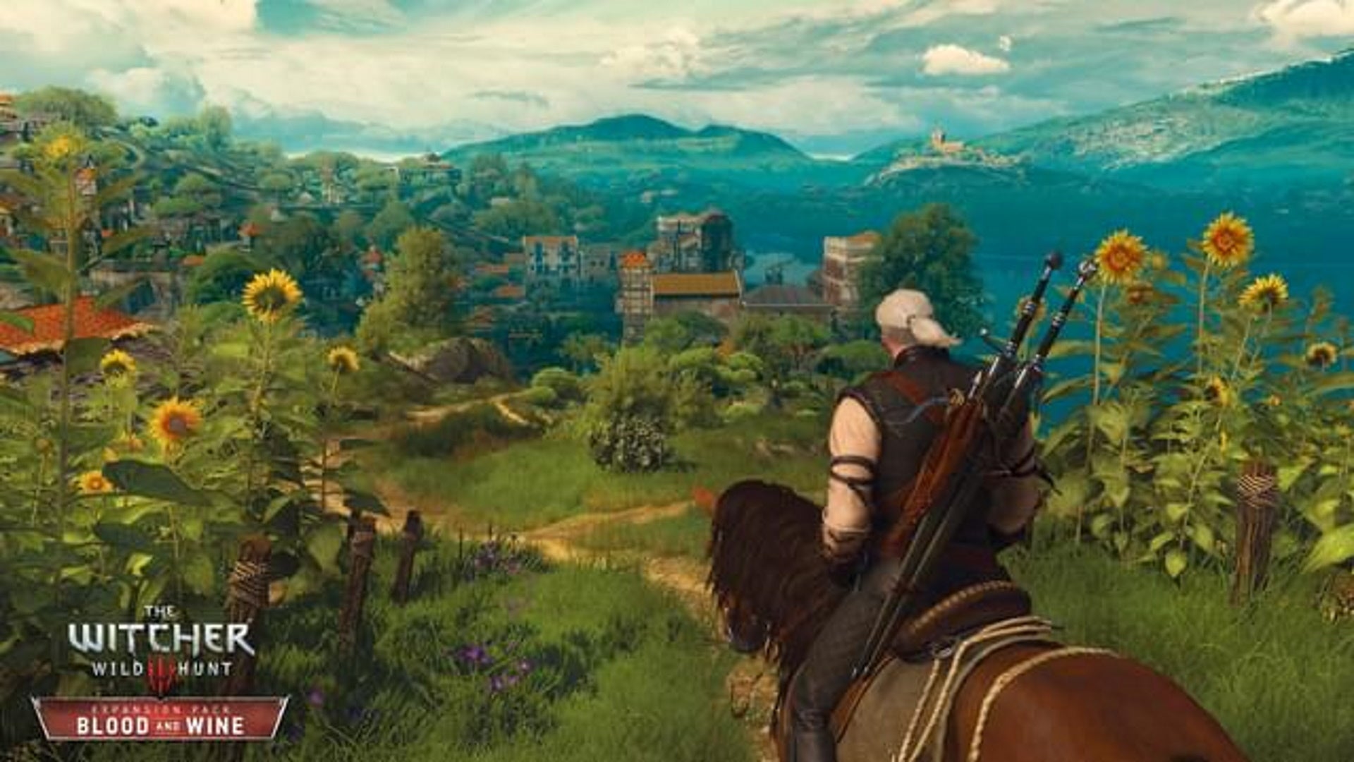 The Witcher 3 Grandmaster Feline gear locations: A man with white hair done up in a ponytail is sitting on a brown horse. They are on a hill overlooking a field of sunflowers, with a mountain range rising in the distance