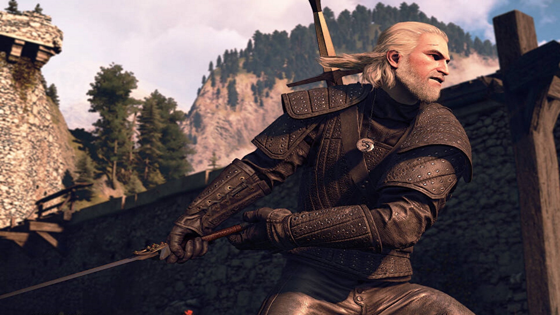 The Witcher 3 saddlebags: A man with black armor and white hair stands in front of a stone house in an action pose. He's holding a sword behind him, preparing to swing